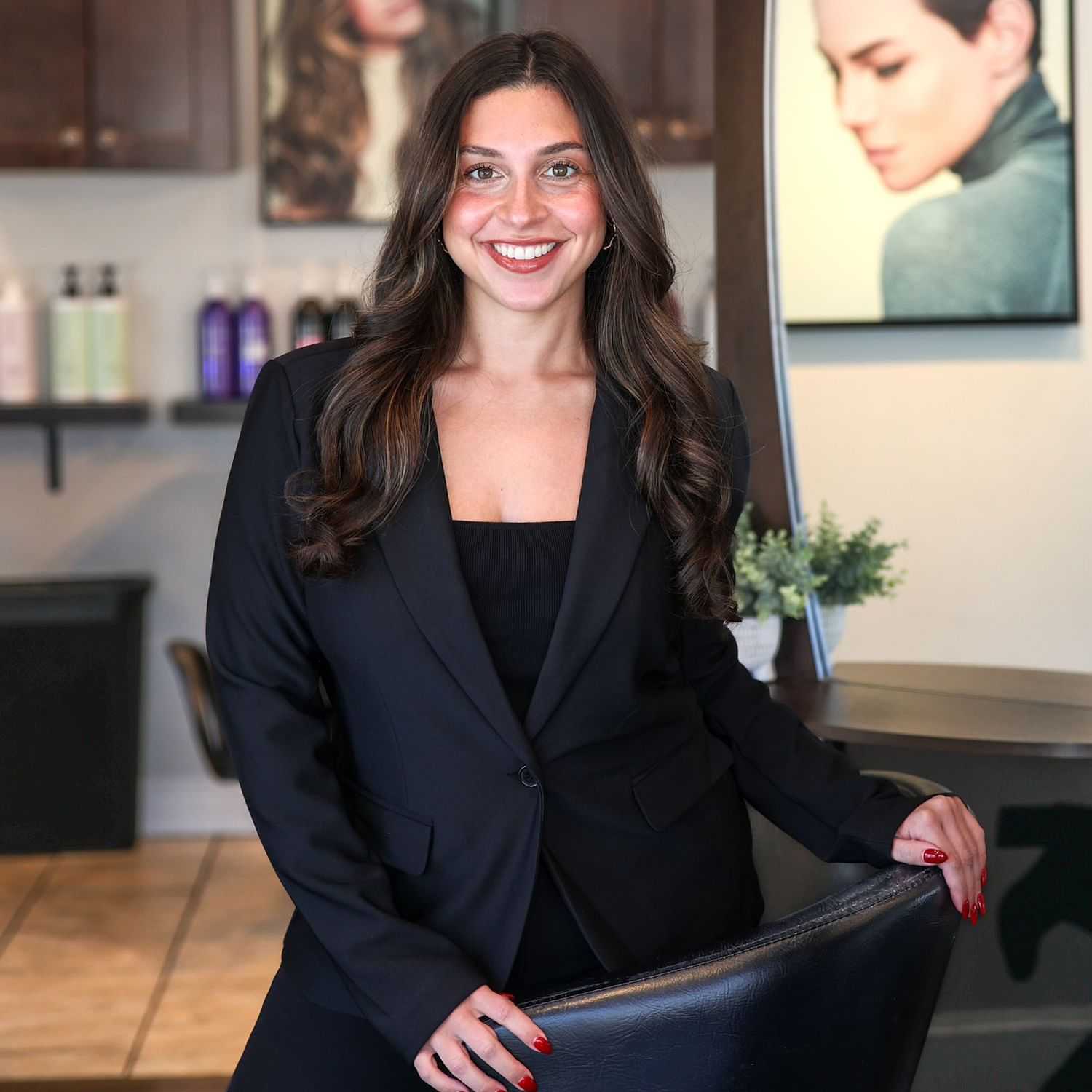 Portrait of Nicole Powers, a professional stylist at Juliana's Salon, showcasing their expertise and style.