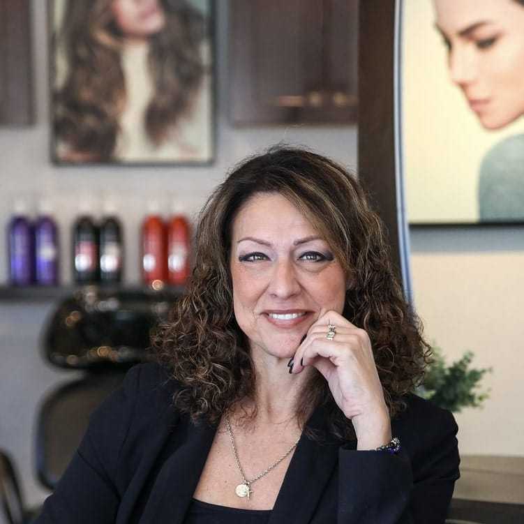 Portrait of Angela, a professional stylist at Juliana's Salon, showcasing their expertise and style.