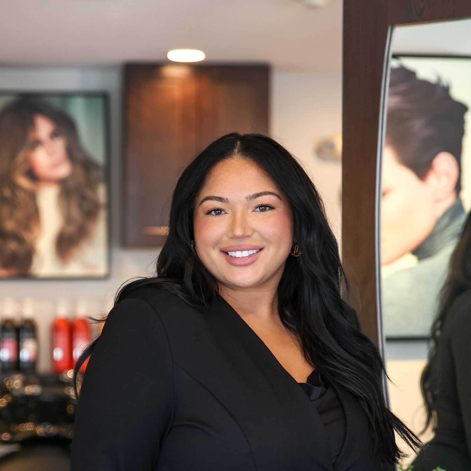 Portrait of Raya Perez, a professional stylist at Juliana's Salon, showcasing their expertise and style.